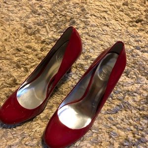 Shiny red patent leather heels